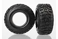 Two black Traxxas Kumho Road Venture RC short course tyres with aggressive tread patterns, shown from front and side angles against a white background.
