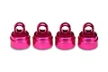 Four pink anodized aluminium shock caps for Traxxas RC vehicles arranged in a row on a white background.