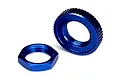 Two blue anodized aluminium nuts for Traxxas 4-Tec 2.0 RC cars, shown against a white background.