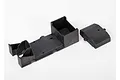 A black plastic Traxxas receiver box and separate cover on a white background.