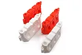 Four 1/10 scale road safety barriers in red and white plastic, arranged in a group on a white background.