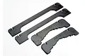 Four black foam pieces for a Traxxas Spartan boat stand, including two long side rails and two shorter cross-members labeled FRONT and REAR.