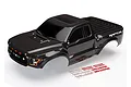 A black Traxxas 2017 Ford Raptor RC truck body shell with a decal sheet on a white background.