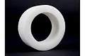 A single white circular foam tyre insert for an RC short course truck against a black background.