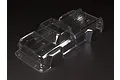 A clear, unpainted polycarbonate RC truck body shell for an ARRMA 1/8 scale Outcast, shown from a high-angle perspective against a black background.
