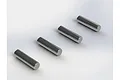Four identical silver metal drive pins arranged in a diagonal line on a white background.