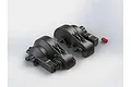 Two black plastic ARRMA centre gearbox case halves and a small red plastic component on a white background.