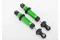 Two green anodized aluminium GTS shock absorbers for Traxxas TRX-4 RC cars, shown against a plain white background.