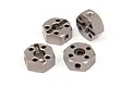 Four gunmetal grey aluminium 12mm RC wheel hex adapters arranged on a white background.