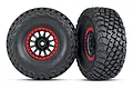Two Traxxas 2.2/3.2 inch BFGoodrich Baja KR3 tires mounted on black and red Method Racing wheels, shown from front and side angles.
