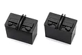 Two black plastic scale model car batteries for the Traxxas Unlimited Desert Racer.