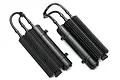 Two black Traxxas UDR shock reservoirs with ribbed cooling fins and connecting hoses, shown against a white background.