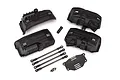 Traxxas TRX-4 wheelbase conversion kit including inner fender wells, suspension links, and chassis plate.