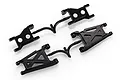 Two black plastic Tamiya RC suspension arm parts trees on a white background.