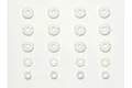 A set of white plastic shock piston discs and spacers arranged in rows on a white background.