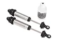 Two Traxxas GTR threaded aluminium shock absorbers with silver bodies and black plastic components, accompanied by a bottle of Traxxas silicone shock oil.