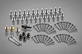 A collection of various metal screws, ball connectors, and fasteners for Tamiya RC models arranged on a grey background.