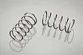 Two silver-coloured metal coil springs for RC car shocks, shown against a light grey background.