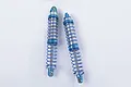 Two RC4WD King 100mm aluminium dual spring shock absorbers with blue springs and blue anodized aluminium components on a white background.