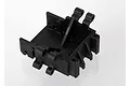 A black plastic front bulkhead spare part for a Traxxas RC vehicle, shown from a high-angle studio perspective.