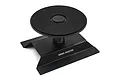 A black aluminium RC car stand by Yeah Racing with a circular rotating top platform and a wide stable base.