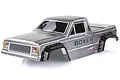 A silver painted RC crawler body shell for the HSP Boxer, featuring black wheel arches and detailed decals on a white background.