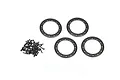 Four black aluminium beadlock rings and a pile of small black screws for RC wheels on a white background.