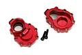 Two red anodized aluminium rear inner portal drive housings for Traxxas TRX-4 with two black mounting screws on a white background.