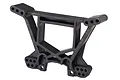 A black plastic rear shock tower for a Traxxas RC vehicle, featuring multiple mounting holes for suspension adjustment.