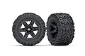 Two Traxxas 2.8 inch Talon Extreme tyres pre-glued onto black RXT six-spoke wheels, shown from front and angled views against a white background.