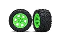 Two Traxxas 2.8 inch Talon Extreme RC tires mounted on bright green RXT wheels, shown from front and side angles against a white background.