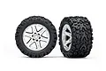 Two Traxxas 2.8 inch Talon Extreme tyres pre-glued onto satin chrome RXT wheels, shown from front and side angles against a white background.