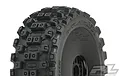 A close-up of a Pro-Line Badlands MX tyre mounted on a black dish rim, showing the aggressive block tread pattern and Pro-Line branding.