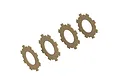 Four beige, gear-shaped slipper clutch pads arranged in a diagonal line against a white background.