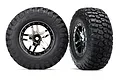 Two Traxxas RC short course wheels with BFGoodrich Mud-Terrain T/A KM2 tyres mounted on black chrome split-spoke rims against a white background.