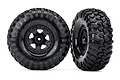 Two Traxxas 2.2 inch Canyon Trail RC crawler tires pre-mounted on black wheels against a white background.