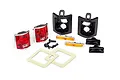 Traxxas TRX-4 1979 Chevrolet Blazer tail light set including red lenses, black housings, amber side markers, screws, and adhesive gaskets.