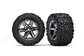 Two Traxxas 2.8 inch Talon Extreme tyres mounted on black chrome RXT rims, shown from front and angled views against a white background.