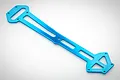 A blue anodized aluminium upper chassis plate for an RC car, featuring a long, skeletonized design with multiple mounting holes.