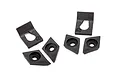 A set of six black plastic body reinforcement components for a Traxxas RC vehicle, including two L-shaped brackets and four diamond-shaped washers.