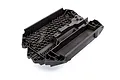 A black molded plastic main chassis for a Traxxas Maxx 4S RC vehicle, featuring a honeycomb reinforcement pattern.