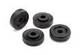 Four black plastic wheel washers for Traxxas Maxx 4S RC vehicles arranged on a white background.