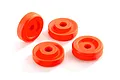 Four bright orange Traxxas wheel washers arranged on a white background.
