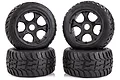 Four Rovan Tarmac Buster II RC buggy wheels with black rims and treaded rubber tyres, stacked in two pairs against a white background.