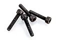 Four black metal cap head screws with fine threading arranged on a white background.