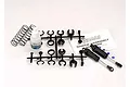 Traxxas Ultra Shock kit including two assembled black shocks, springs, plastic parts tree, silicone oil, and instruction sheet.