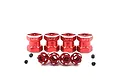 Four red aluminium 12mm hex adaptors with YR logo, arranged in a row with small black grub screws in front on a white background.