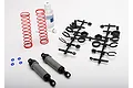 Traxxas XX-Long grey body ultra shock absorber kit including two grey shock bodies, two red springs, a parts tree, and shock oil.