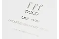 A collection of assorted metal RC hardware including body clips, E-clips, and C-rings arranged on a white background.