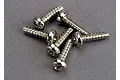 A cluster of six silver-colored metal binder head screws with coarse threads, arranged on a grey surface.